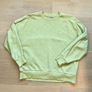Sweaty Betty Essentials avocado green sweatshirt.